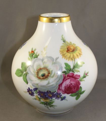 KPM Porcelain Vase,: modeled in squat, globular form and decorated with sprays of flowers. height 17cm