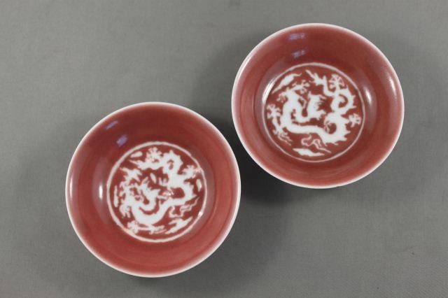 Pair of Chinese Porcelain Dishes,: decorated with white dragons, on pink ground, seal marks to base,d ,9.5cm, (2)