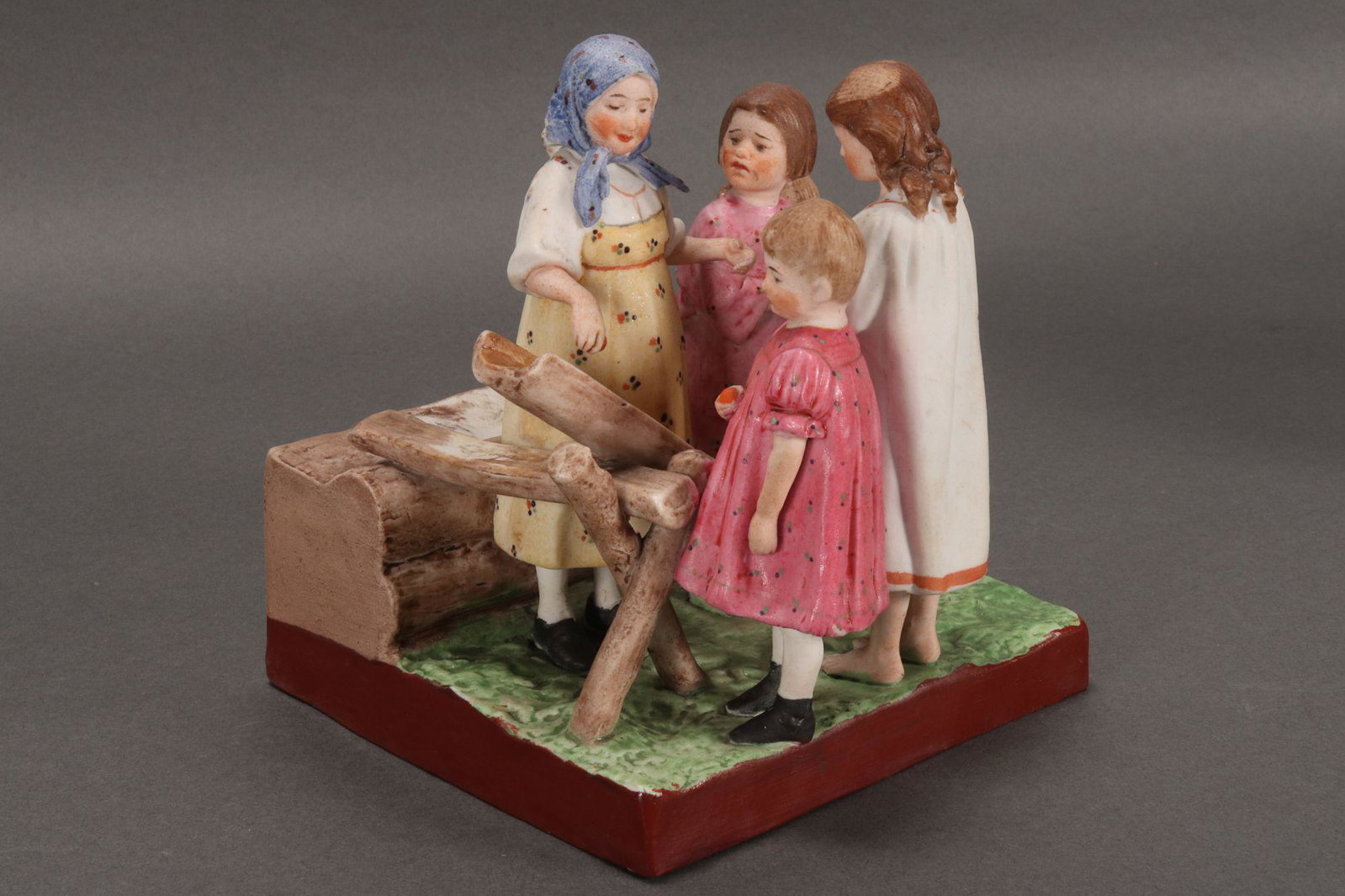19th Century Russian Gardner Porcelain Figure: Group, c.1880, depicting five young children egg rolling, red factory stamp to base with impressed marks, height 15cm