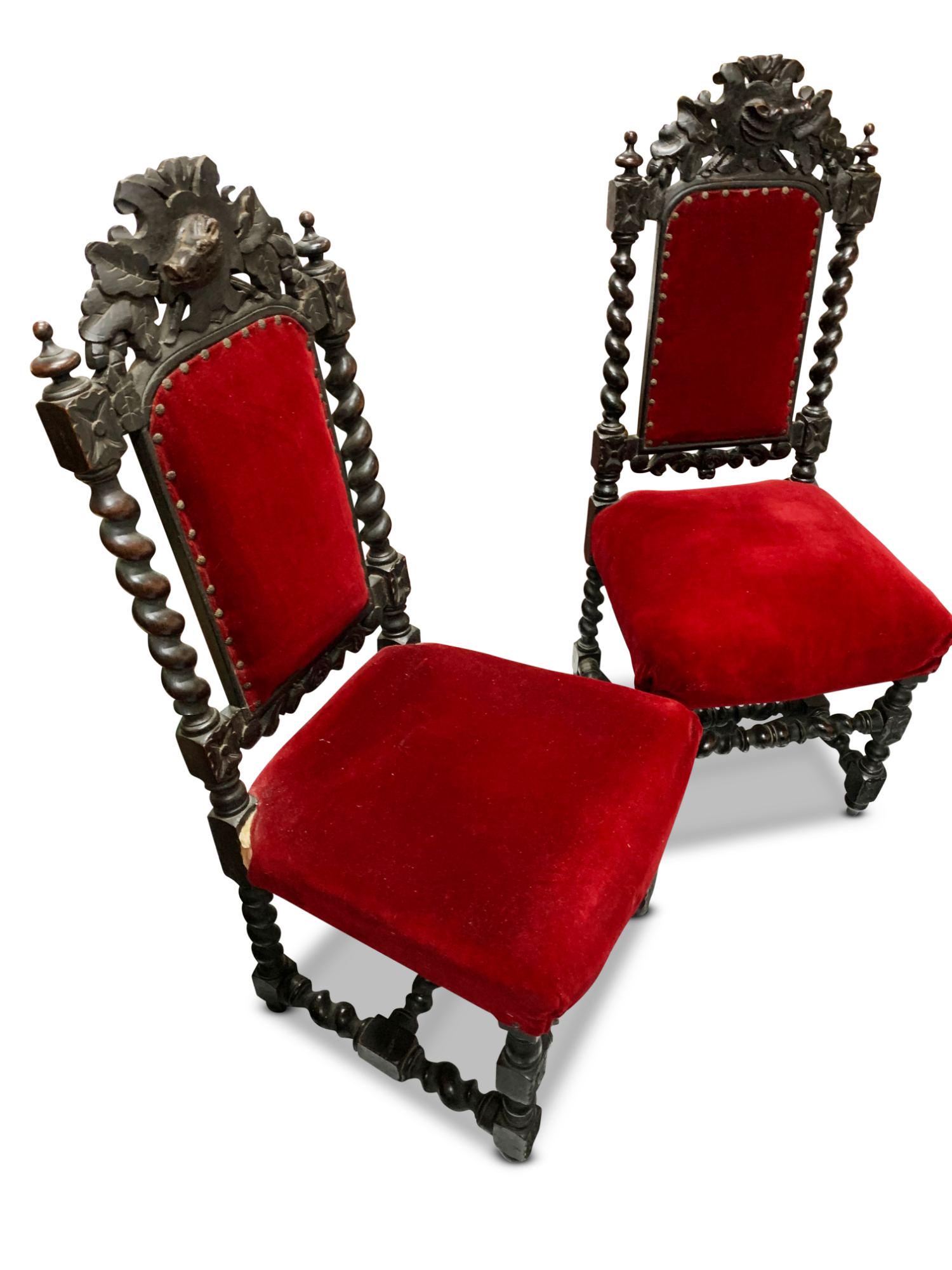Set of Six Italian Baroque Style Dining Chairs,: with carved crest rail of boars head and oak leaves, above upholstered back and seat in red velvet, on turned legs united by stretchers, a/f (6)