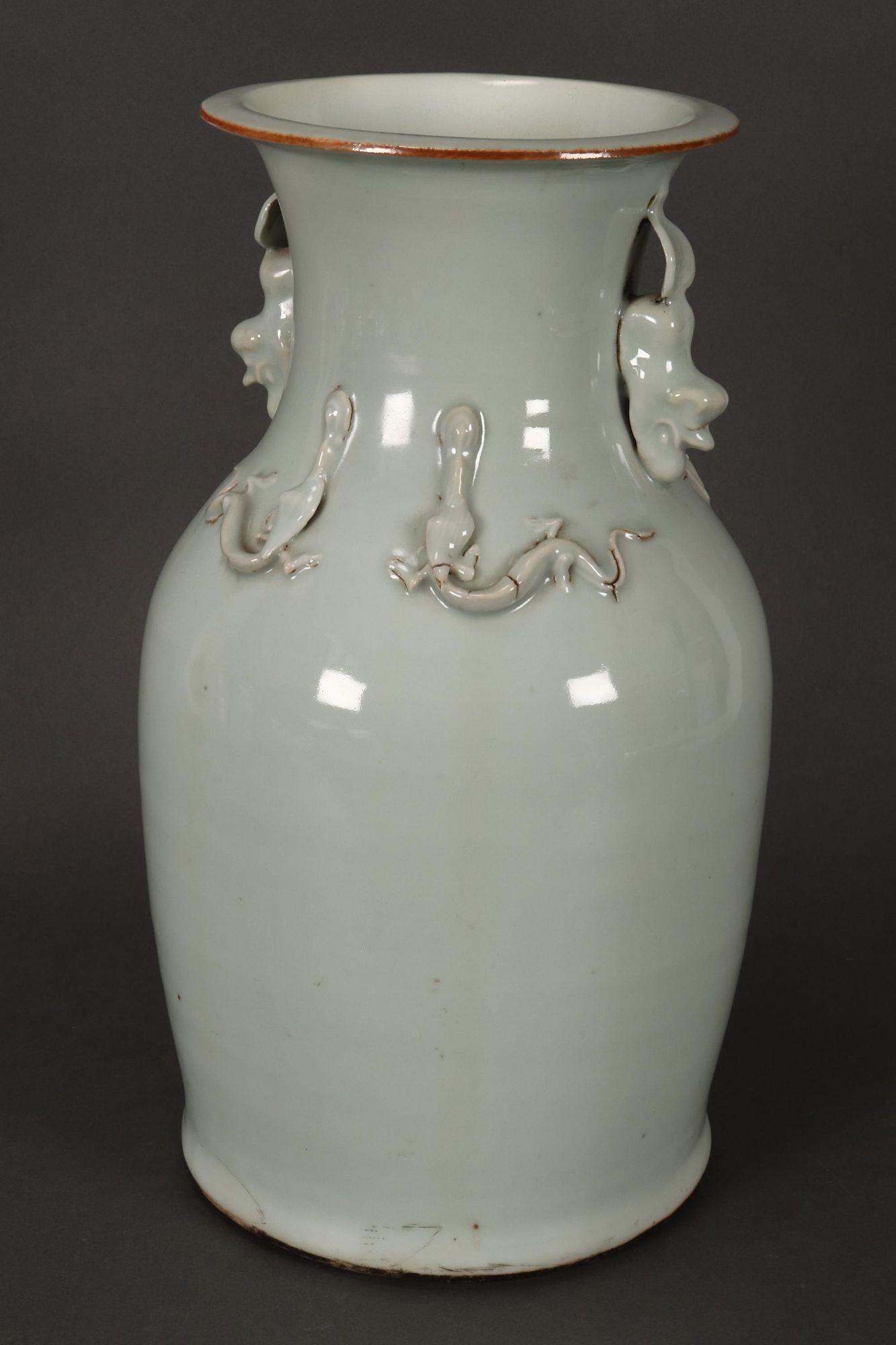 Large Chinese Qing Dynasty Vase,: with spreading lip, above an ovoid body, decorated with kylins to the neck and chilong dragons to the shoulders, with biscuit coloured rim and white/pale green celadon glaze, on a circular foot, on wo