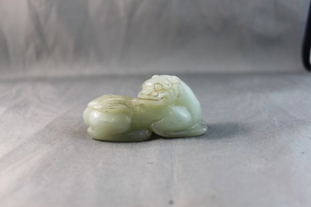 Chinese Carved Jade Dog,: carved in the form of a reclining dog, with head turned back, l 7cm