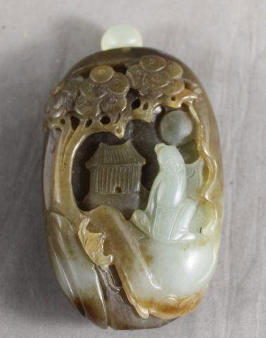 Chinese Green and Brown Jade Boulder Snuff Bottle: and Stopper, decorated with a scene of a figure seated under branch, h 8cm