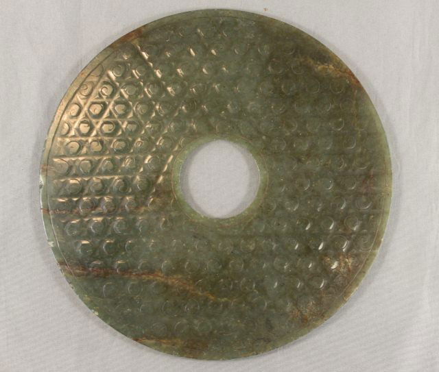 Chinese Jade Bi Disc,: of circular form, decorated with triangle and dimple form, d 15cm