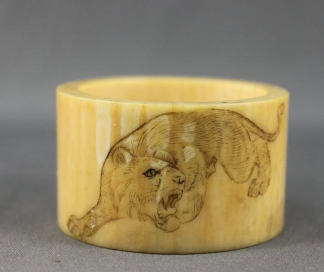 Japanese, Meiji Period, 19th Century Napkin Ring,: of circular form decorated with tigers
