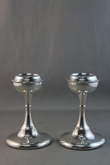 Pair of Edwardian Sterling Silver Candlesticks,: hallmarked, Birmingham, 1910, J.H.W, with shaped semi sphere scones above a elegant stem on a circular foot, h 10cm