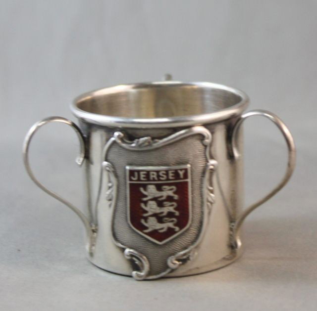 Edwardian Sterling Silver Miniature Loving Cup,: hallmarked, Birmingham, 1904, L & S, of cylindrical form, set with a shield cartouche and red enamel armorial for Jersey, h 4cm