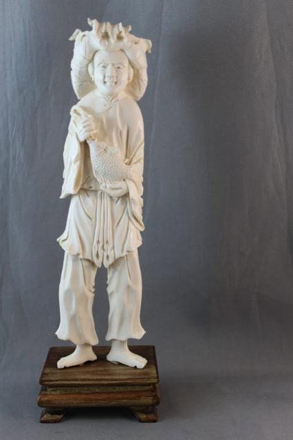 Chinese Ivory Figure of A Fisherman,: modelled in traditional headress , proudly displaying his catch on hardwood stand h 21cm oh 24cm