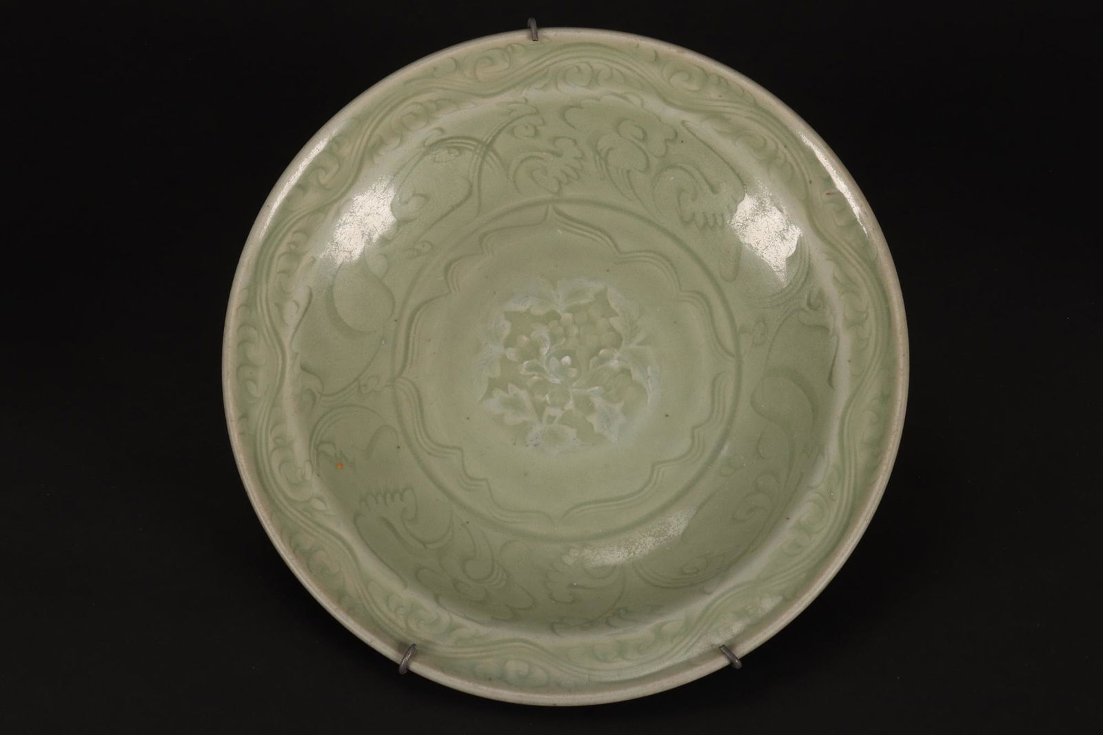 Chinese Ming Dynasty Celadon Charger,: impressed with central floral motif, and incised surrounding decoration, in olive green tones, diameter 26cm