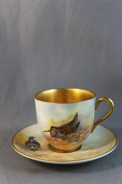 Royal Worcester Porcelain Demi Tasse and: Saucer, the saucer painted with a Partridge, the demi tasse painted with a Woodcock, signed Maybury, (2)