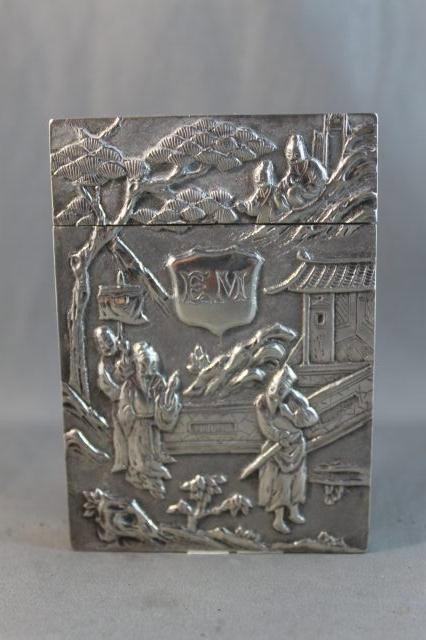 Superb Early 20th Century Chinese Silver Card Case: by Wang Hing & Co (Late 19th/Early 20th C), of rectangular form, one side beautifully embossed with exotic flowers and foliage, the other set with shield monogram surrounded by five noble figures in g