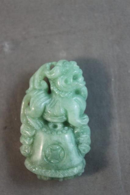 Chinese Carved Pi Yao in Burmese Jade,: finely carved mythical creature above bell representing the most powerful god of wealth and good fortune, h 4cm