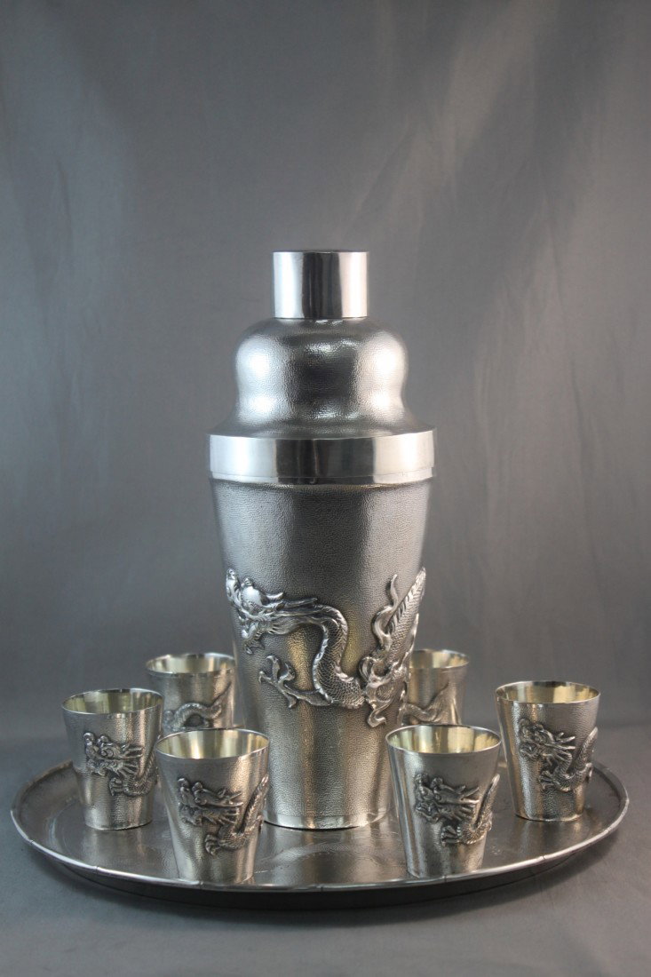 Chinese Sterling Silver Cocktail Shaker Set: comprising four matching shot glasses and tray, with dragon design, total weight 1149gms