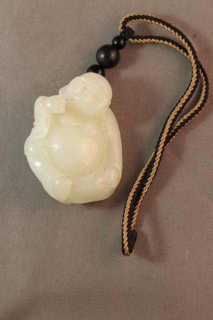 Chinese White Jade Figure of a Happy Buddha,: mounted on a string h 5.5cm