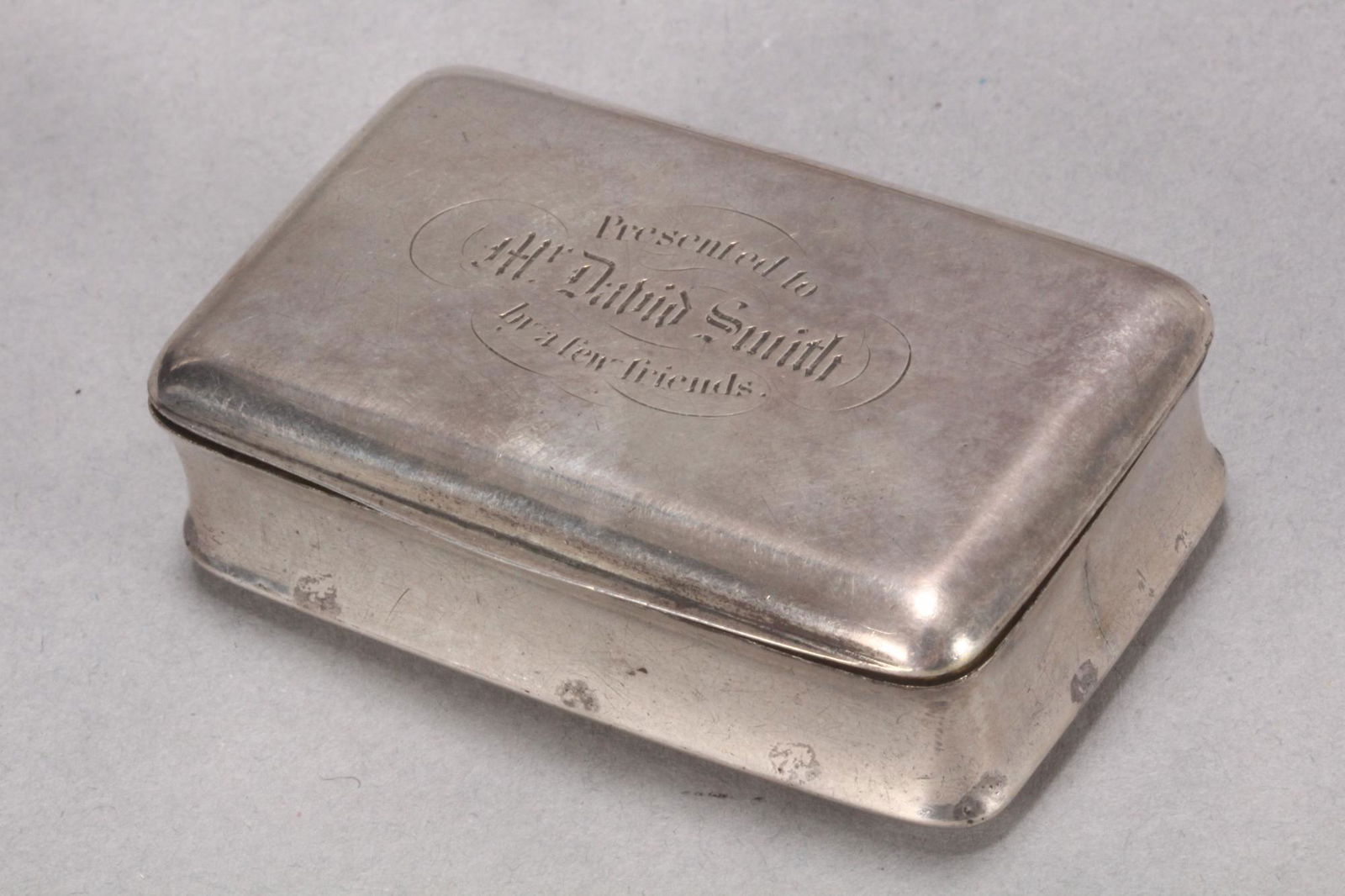 George IV Scottish Sterling Silver Snuff Box,: hallmarked Glasgow, 1824, J.M, of plain rectangular form, the hinged cover engraved with inscription 'Presented to//Mr. David Smith//by a few friends,' with gilt interior, total weight 49gm, 5.5cm x 3