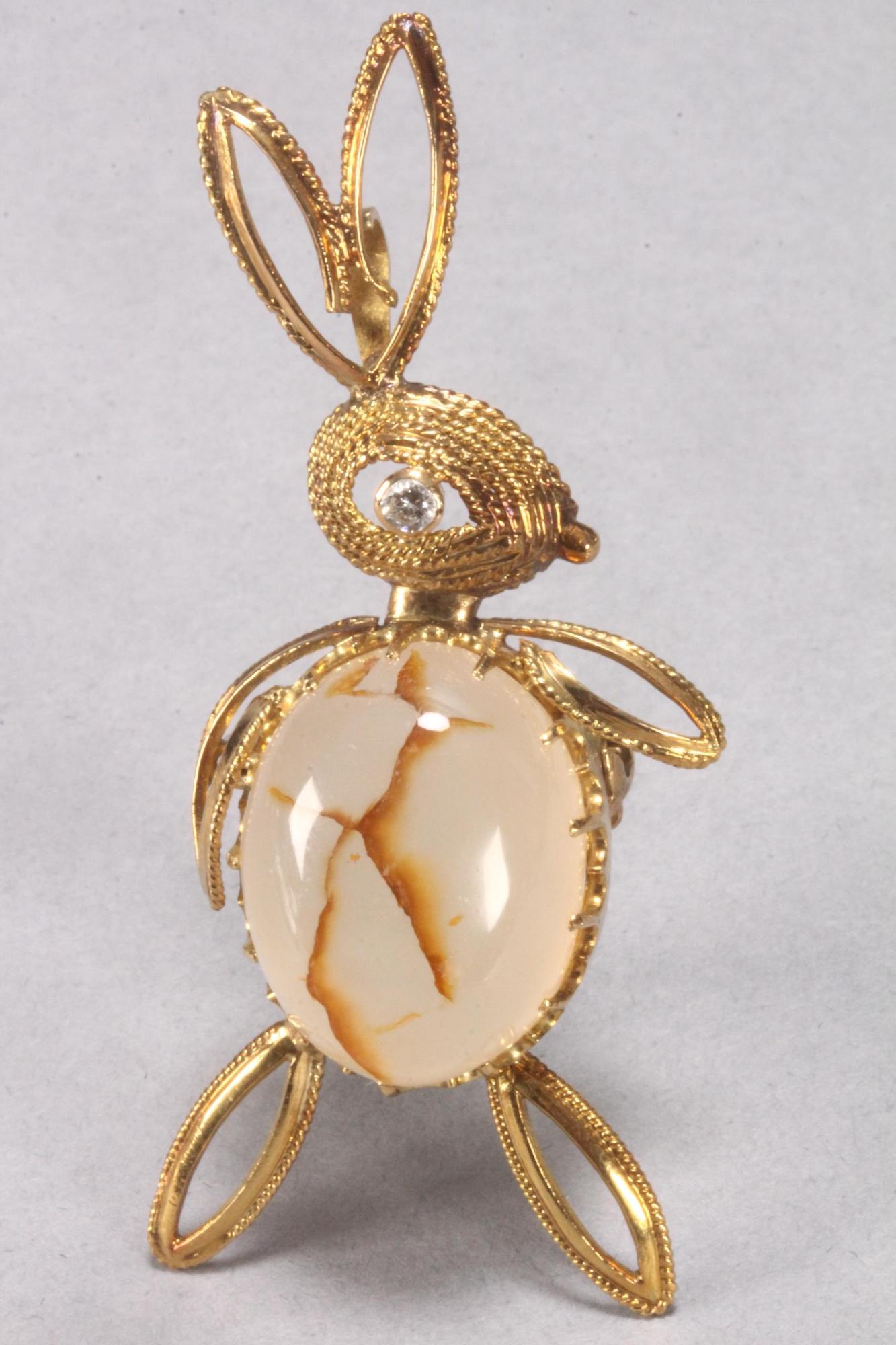14ct Gold, Diamond and Agate Brooch,: unmarked (tested 14ct), in the form of a rabbit with cabochon agate body, in milky tones with orange/brown inclusions, set on a multi claw gold framework featuring a filigree ropetwist head set with c