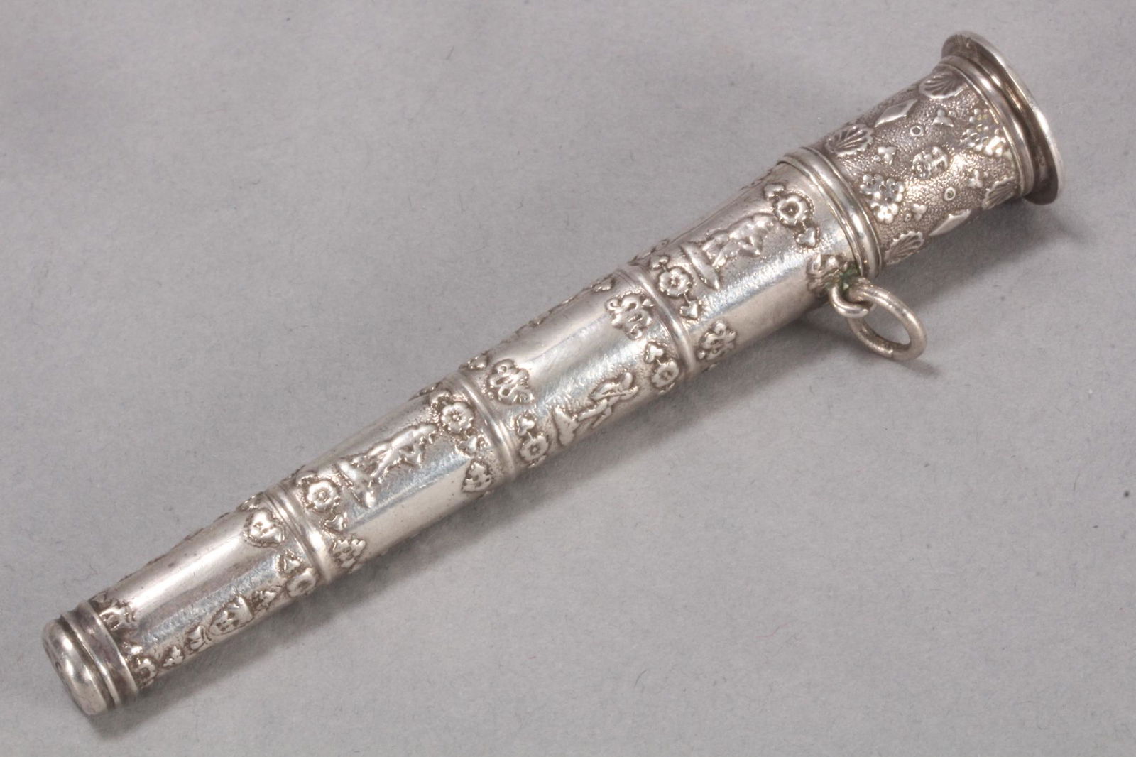 18th/19th Century Dutch Silver Needle Case,: of tapered form, decorated with repeating panels depicting figures and flowers, total weight 20gm, length 9.5cm Provenance: Collection of the late Fredric Sinfield, Sydney NSW, 1938 - 2008