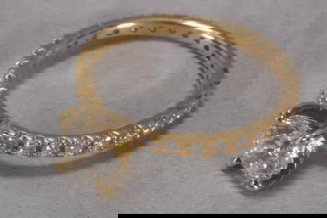 18ct Yellow Gold, Diamond Solitaire Ring,: stamped 750, featuring a central 0.8ct brilliant cut diamond (colour G/clarity SI2) in a four prong setting, set above an 18ct yellow gold band set with twenty eight brilliant cut diamonds in a v-spli