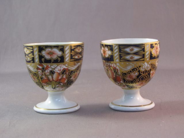 Pair of Royal Crown Derby Egg Cups,: modelled in the usual palette (2)