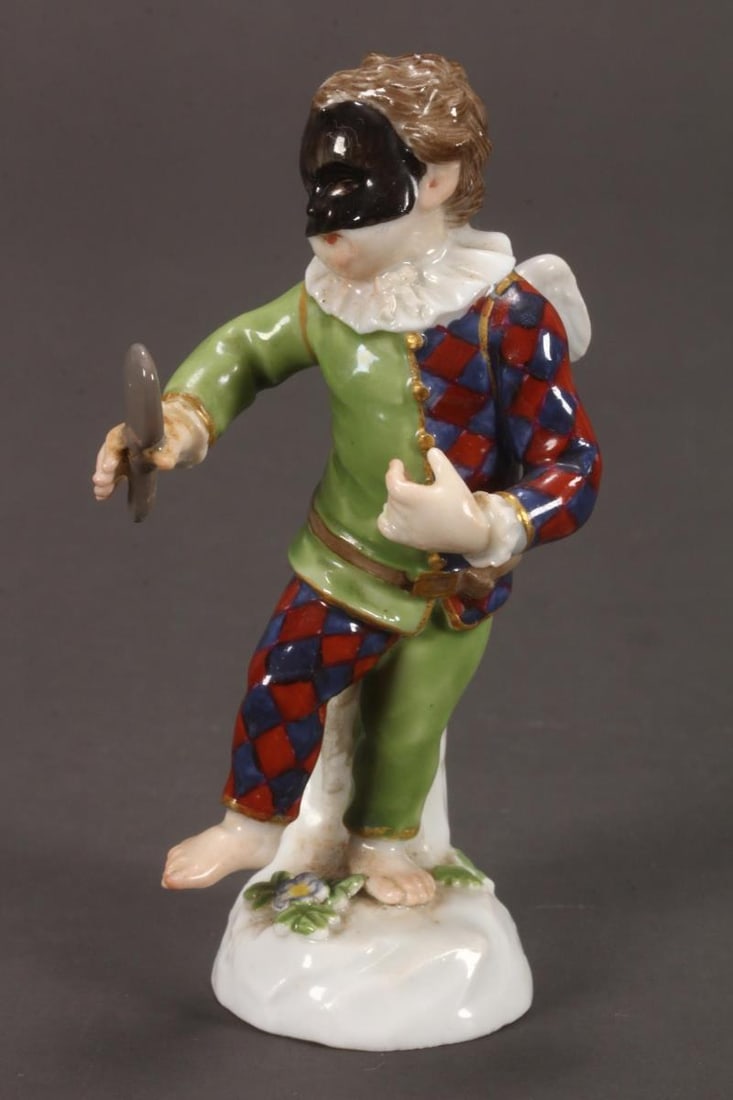 19th Century Meissen Porcelain Figure,: in the form of a petit harlequin with wings, in tones of green, red, blue and black, with gilt accents, 2nd mark blue crossed swords to base, height 9cm