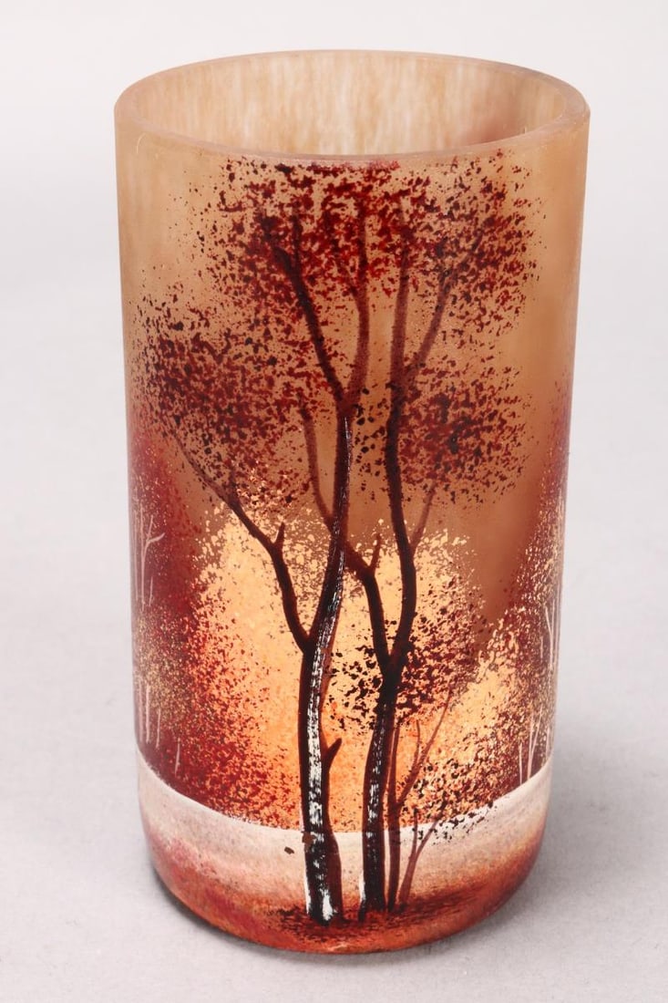 Petite Daum Nancy Autumn Forest Vase,: of cylindrical form, beautifully decorated with landscape scene depicting trees with autumnal orange, red and brown foliage on a mottled brown glass ground, signed Daum Nancy to base, height 11.5cm