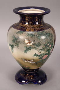 Japanese Kinkozan Satsuma Jar,: of baluster form, decorated with two large finely painted reserves, with birds amongst bamboo and flowers and foliage, with roosters and blossoming tree verso, on a cobalt ground with gilt brocade dec