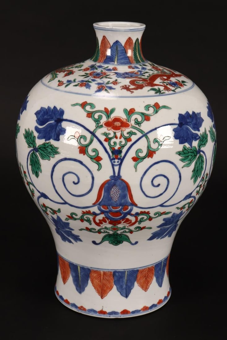 Chinese Wucai Porcelain Vase,: of meiping form, decorated with frieze depicting stylised foliate scrolls and bats, between phoenix and and palmette borders, six character mark within double rings to base, height 34.5cm