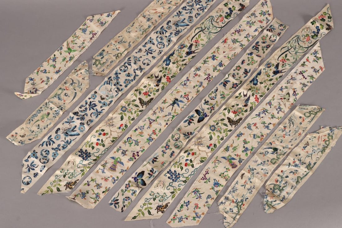 Quantity of Chinese Embroidered Robe Ribbon Trims,: embroidered with butterflies, birds and flowers, in tones of blue, green, red and purple, some accented with gold thread, on cream silk (qty)