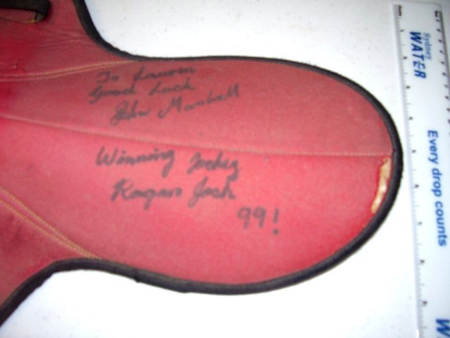 A racing saddle,: used by jockey John Marshall in the early 90s, signed and inscribed by him “winning jockey Rogan Josh ‘99”. Marshall won the Melbourne Cup in 1999 on Rogan Josh. Collectable.