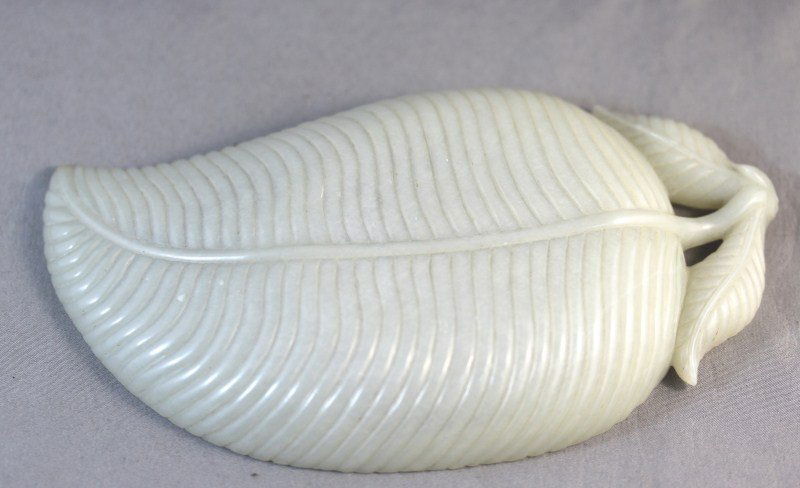 Fine Chinese White/Pale Green Jade Dish,: finely carved in the form of a leaf, l 17cm Provenance: Hollywood Road, Hong Kong