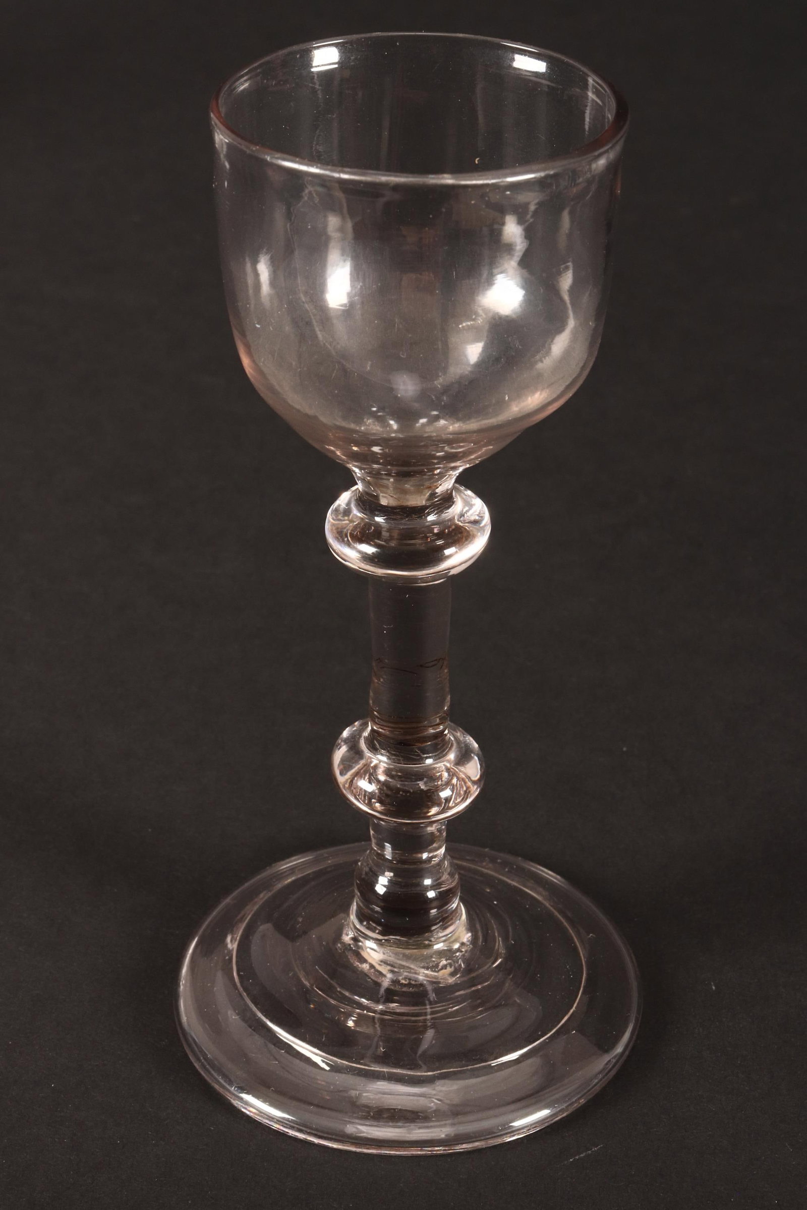 18th Century British Balustroid Cordial Glass,: c.1745, with ogee shaped bowl, above double knop stem, on circular fold foot, height 13cm Provenance: A number of pieces of the collection featured in the 'Circle of Glass Collectors 'Commemorative Ex
