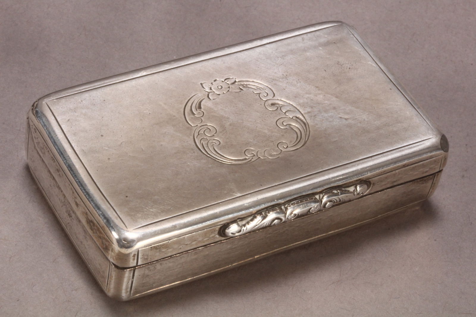 Victorian Sterling Silver Snuff Box,: hallmarked Birmingham, 1849, Y&W (Yapp & Woodward (John Yapp & John Woodward)), of rectangular form, the hinged cover engraved with central acanthus bordered cartouche, with cast acanthus thumb piece,