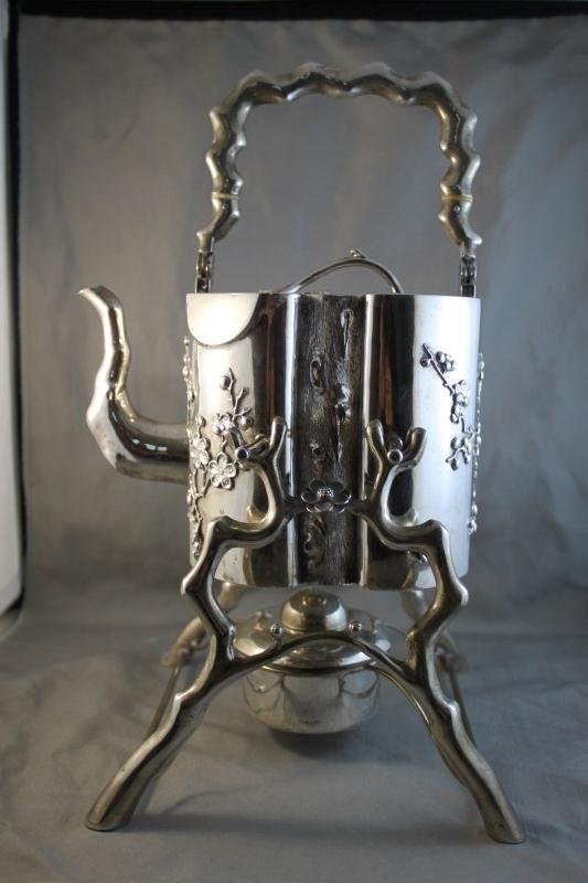 Rare and Unusual Chinese Silver Teapot, Stand: and Burner, in the form of a tree trunk, decorated with prunus on a branched stand with burner, impressed marks to base, total weight 1050gms,h 34 (with stand and handle)