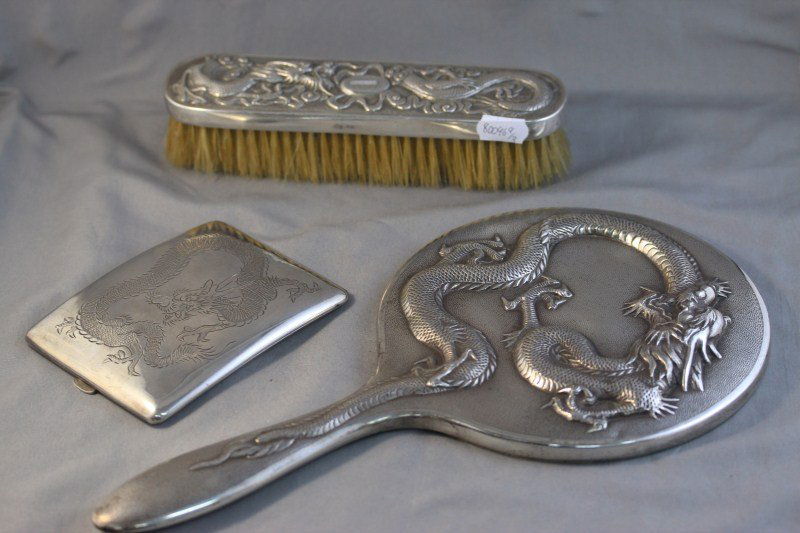Chinese Silver Hand Mirror and Brush,: together with a Chinese cigarette case, all decorated with dragons, (3)