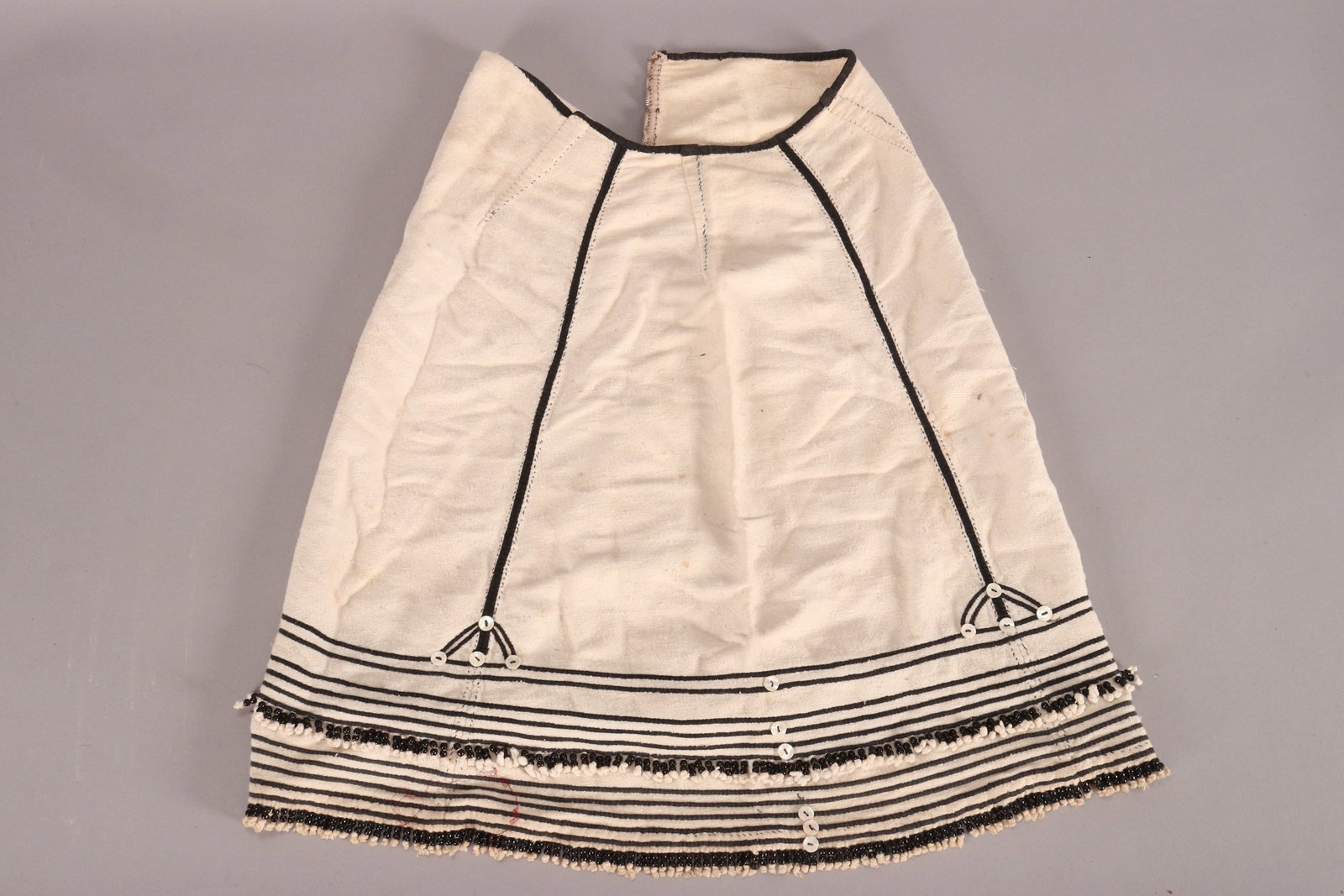 Xhosa People Beaded Skirt, South Africa,: in cotton, with black borders and bead fringe accents, length 66cm
