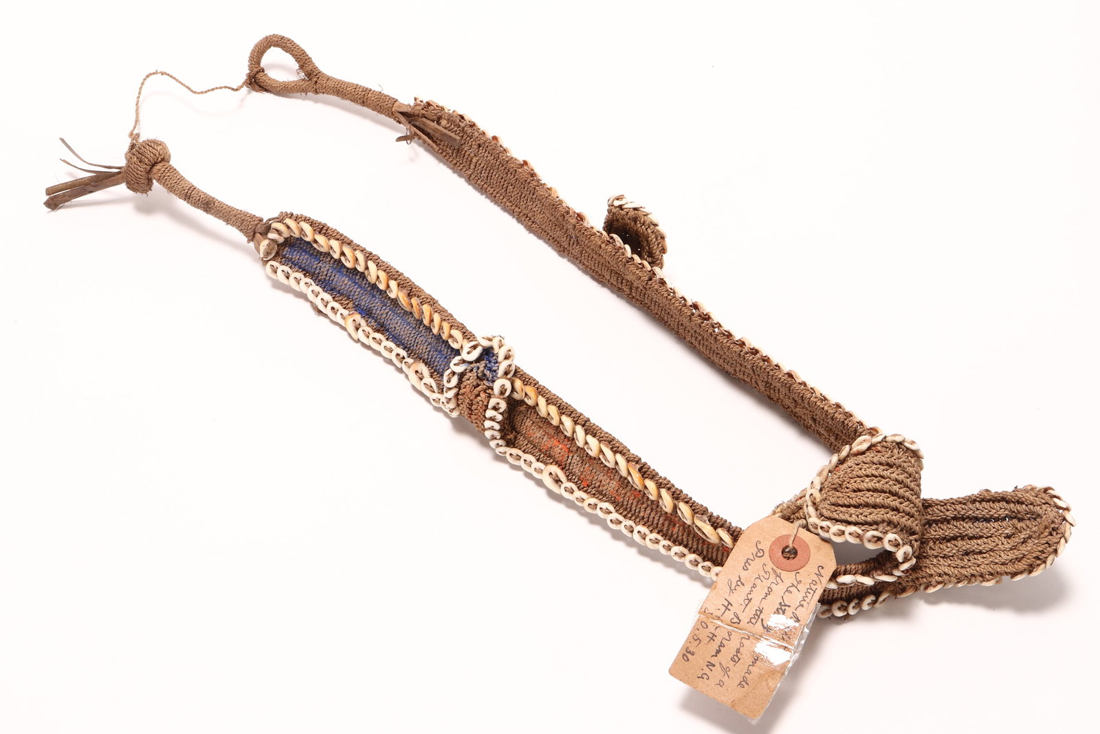 Abelam Belt, Papua New Guinea,: in woven natural fibre, accented with a series of cowrie shells to the borders, with old collection label, length 44cm (doubled)