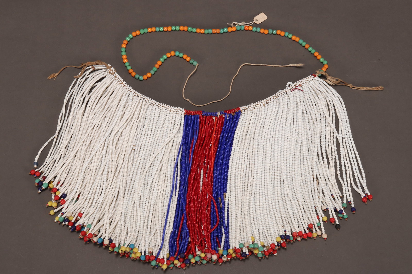 Bhaca People Bead Puberty Skirt, South Africa,: with beaded tassels, in tones of white, red, blue, yellow and green, height 20cm and width 31cm