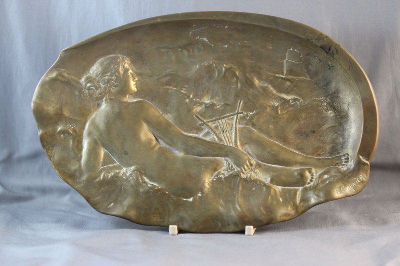 Late 19th Century Bronze Figural Dish,: by J. Garnier, of oval form, depicting a siren with harp reclining amongst the waves viewing a sailing ship in the back ground, signed,