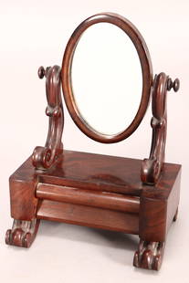 Victorian Apprentice Table Mirror,: set with oval mirror, flanked by scrolled supports, above a rectangular base set with drawer, raised on scrolled feet, 26cm x 20cm