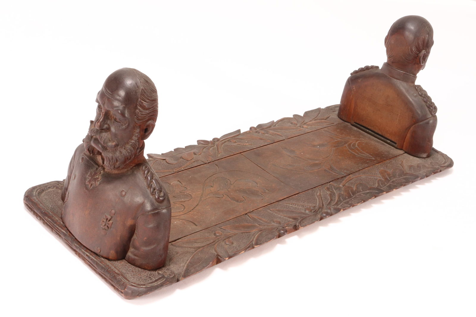 Early 20th Century Extendable Book Rest, c.1910,: carved with two busts of Wilhelm II, the last German Emperor and King of Prussia, with an oak leaf border, length 47cm and 70cm (extended), Provenance: Private Collection of the Late Derek Greengrass,