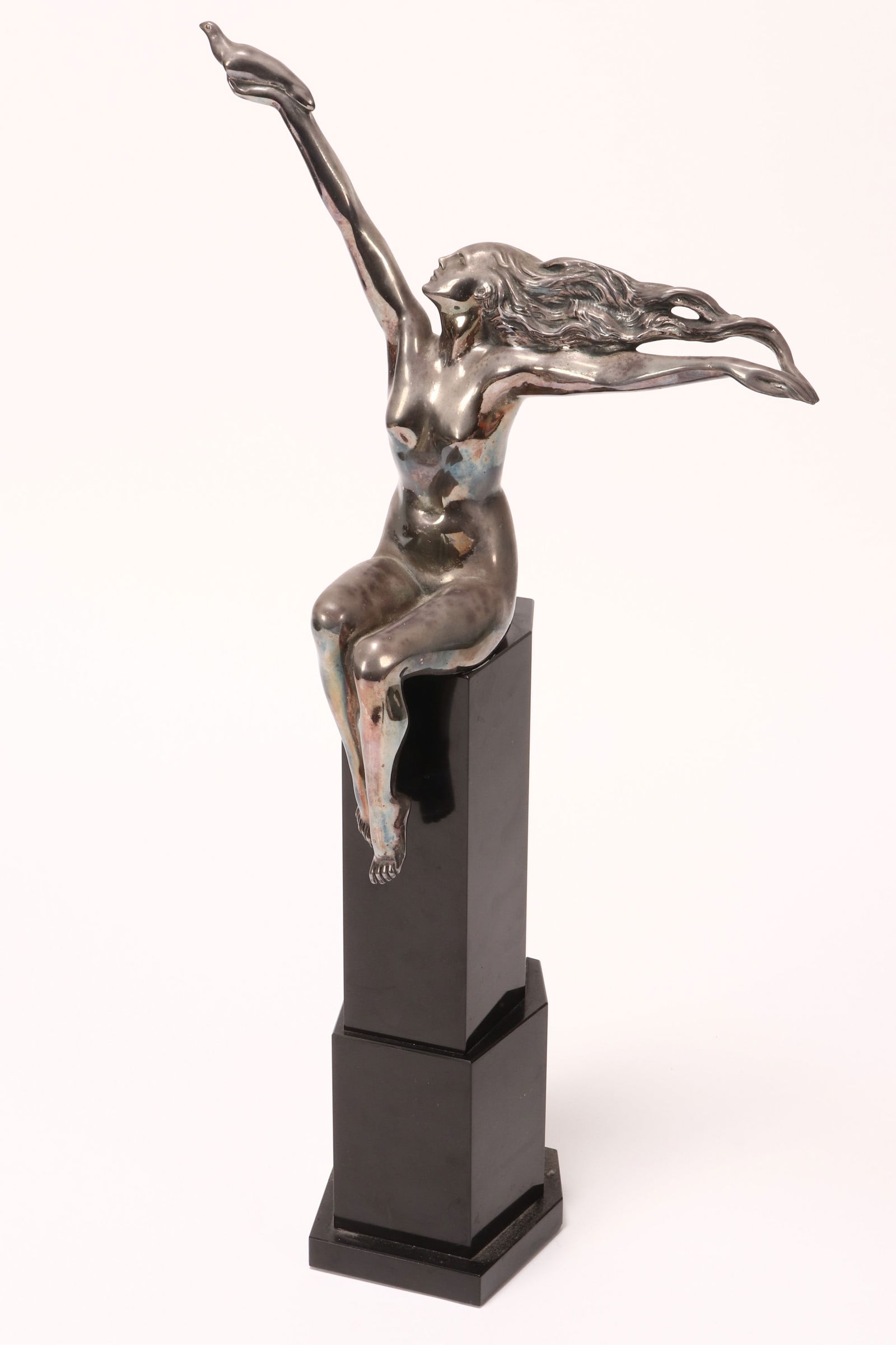 Amedeo Gennarelli (Italian, 1881-1943),: The Carrier Pigeon, c.1925 silvered bronze on marble signed 'A.Gennarelli' to plinth total height 57cm
