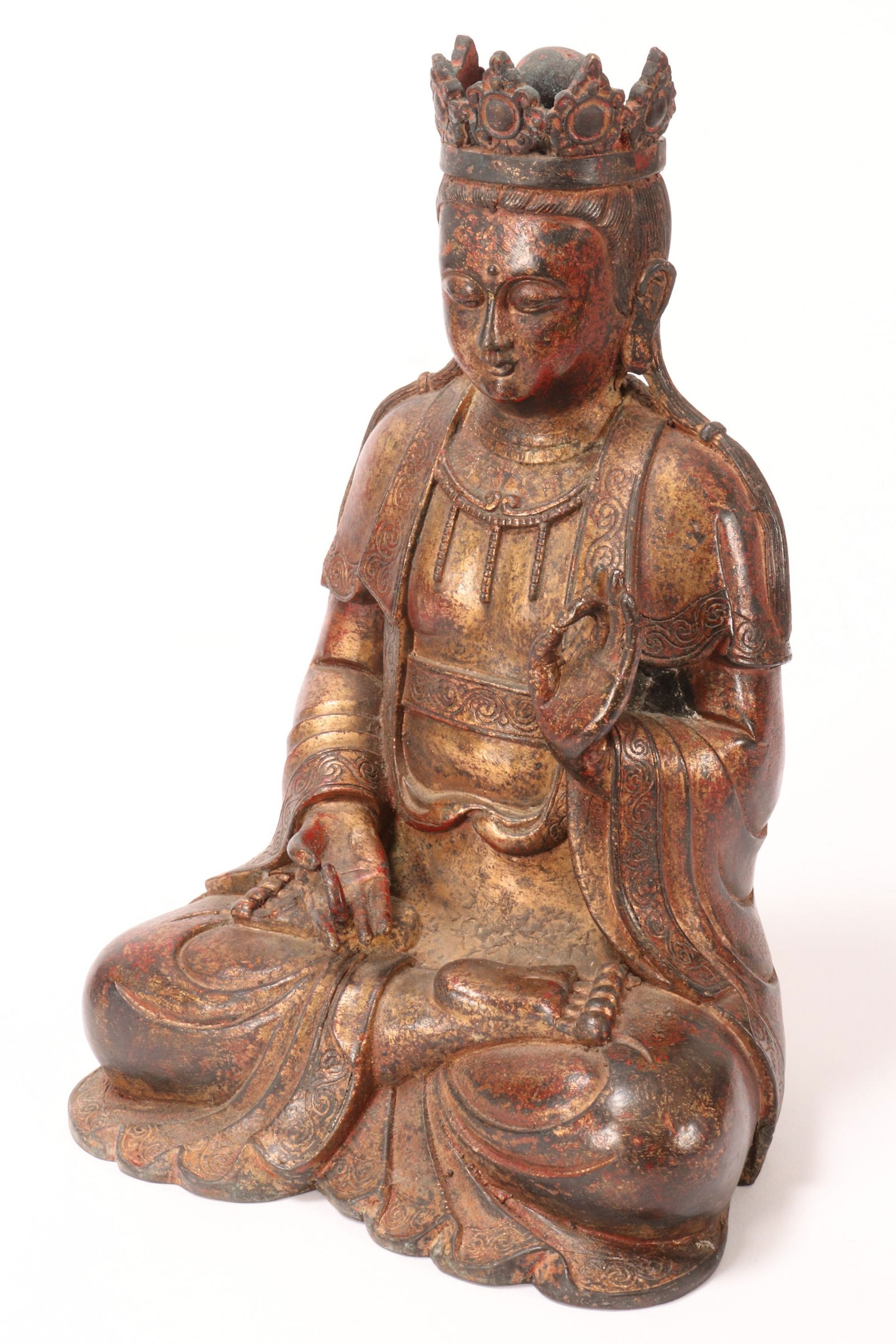 Sino-Tibetan Gilt Bronze and Lacquer Figure,: depicted seated in robes, with a downwards gaze with hands in mudras, height 25cm