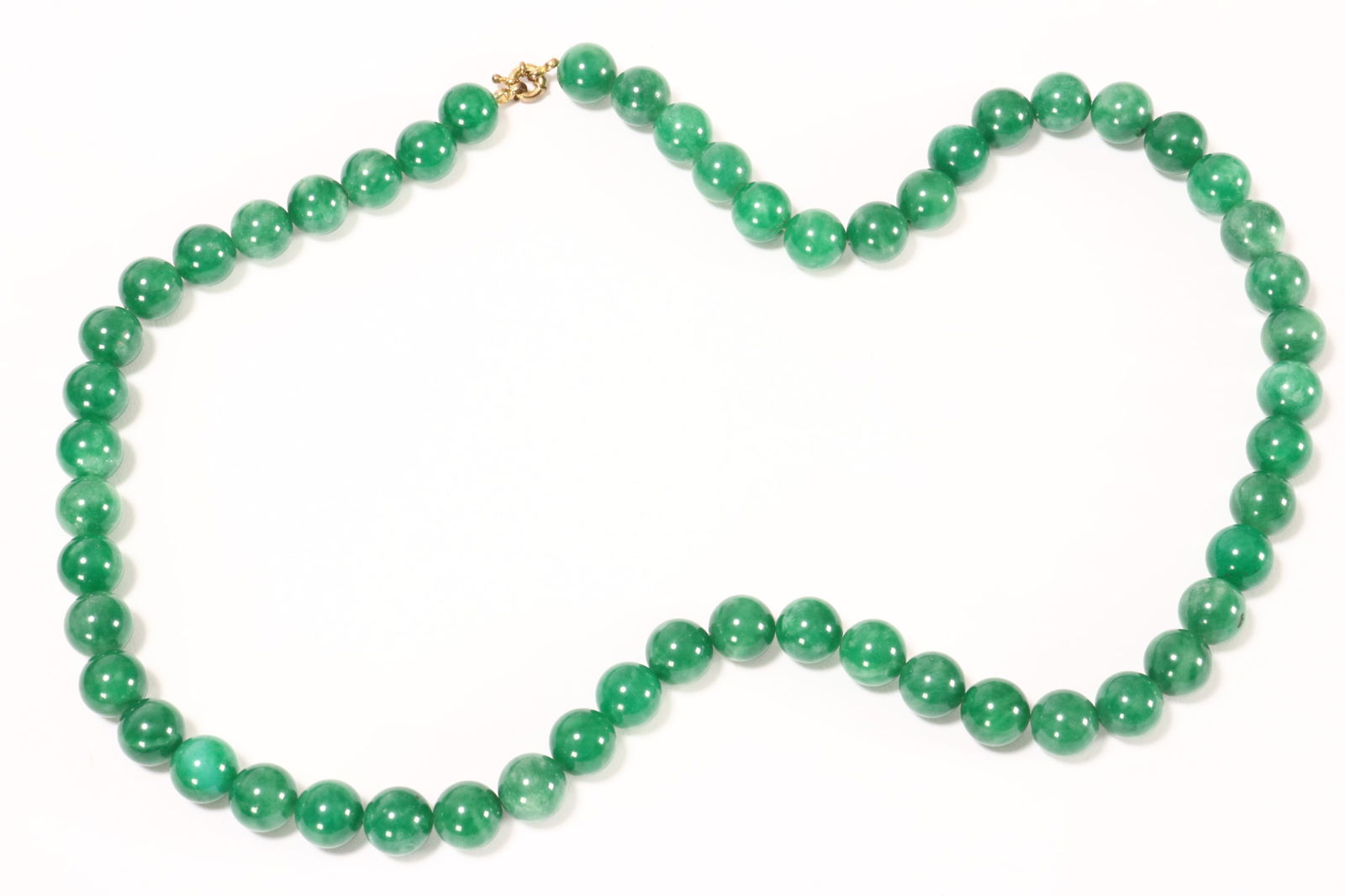 Chinese Jade Bead Necklace,: of single string, beads of rounded form in green tones, with gilt clasp, bead width 1cm
