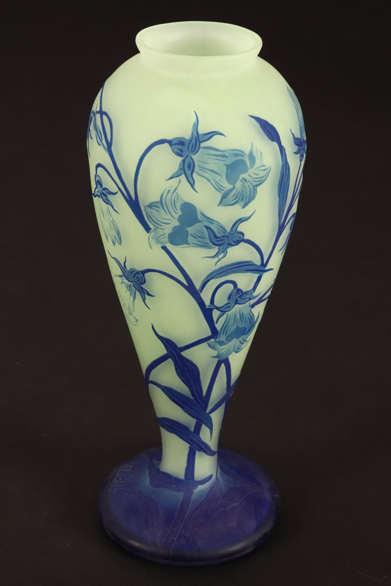 Loetz Cameo Glass Vase,: of tapered ovoid form, decorated with a foliate spray, in blue on a pale green ground, on a circular foot, signed Richard, height 22cm