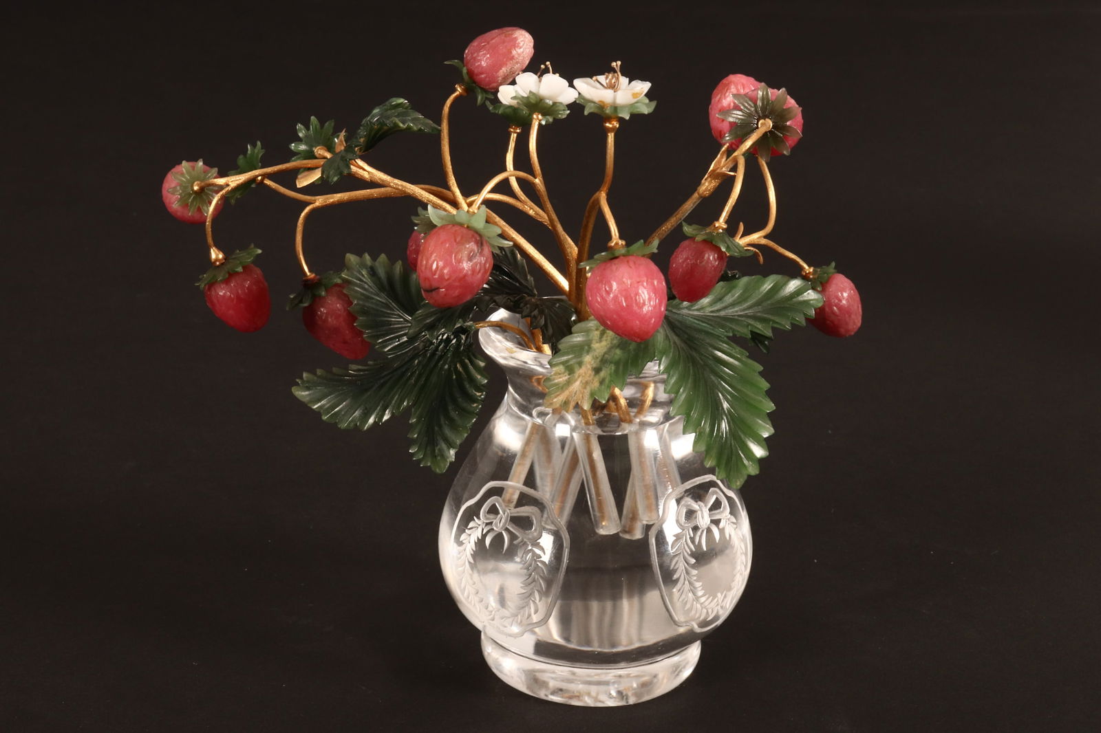 Stunning Russian Rhodonite, Gold, Nephrite and Crystal Study of a Strawberry Plant,: the gold stems (tested minimum 14ct finesse) supporting strawberries, flowers and foliage, within a solid crystal vase, with etched wreath and ribbon motifs, the branches marked Faberge in Cyrillic, h