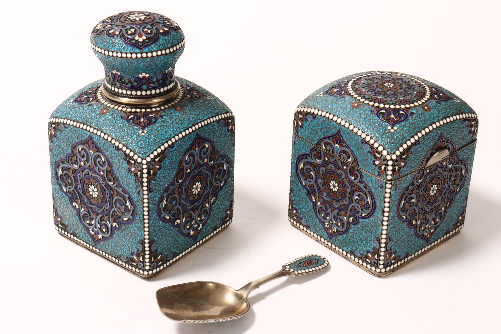 Stunning 19th Century Russian Silver and Enamel Tea Caddy, Sugar Box and Caddy Spoon,: c.1894, marked G.K for Gustav Klingert, assay Anatoly Apollonovich Artsbashev (2) and Alexsander Vladislavoich (1), Moscow, of rectangular form, the caddy with spherical cover and silver and cork stop
