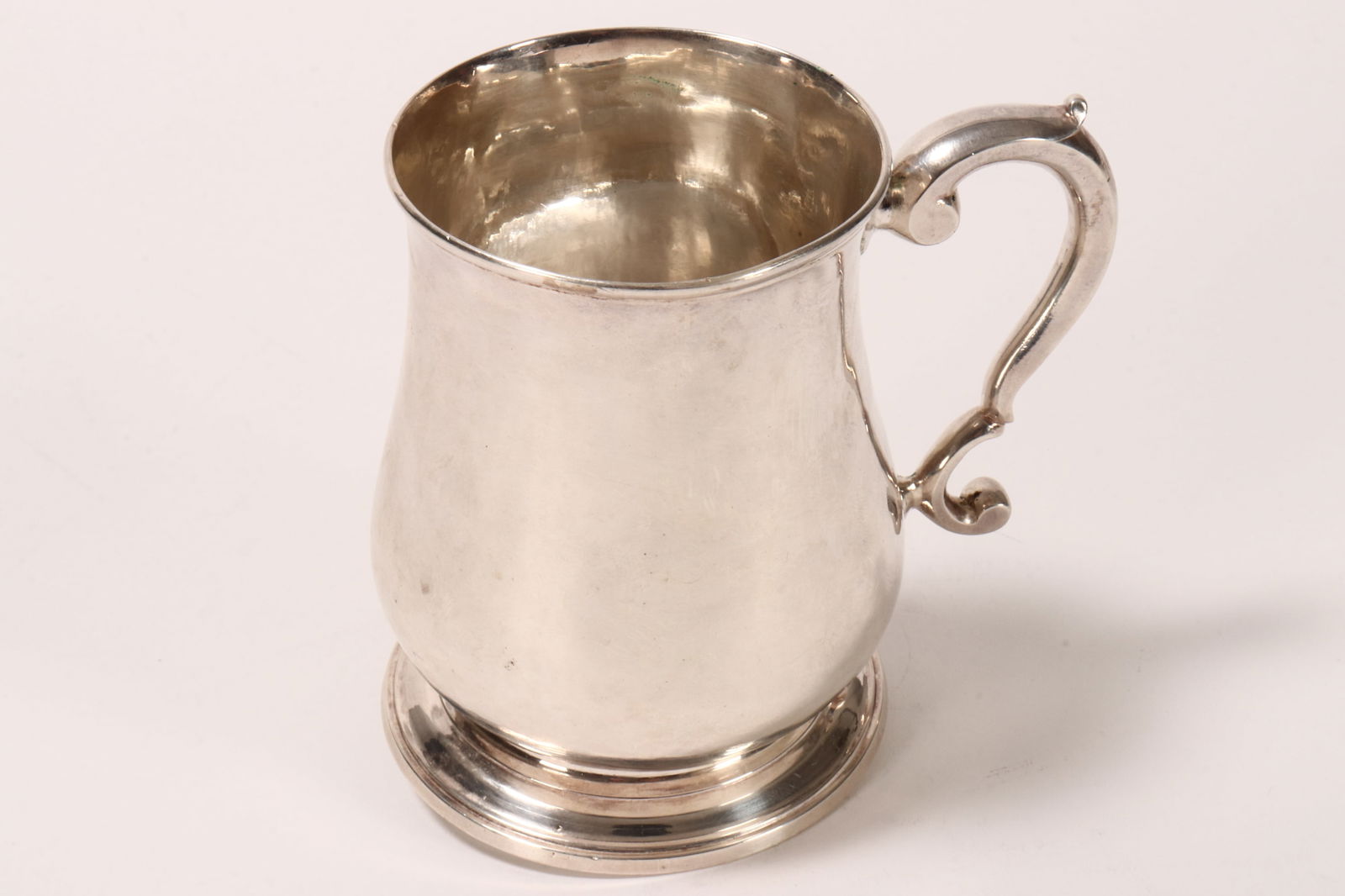 George II Sterling Silver Tankard,: hallmarked London, 1749, J.W (Thomas Whipham), of baluster form, the s-scroll handle engraved with initials and 1751, raised on a circular foot, a/f, total weight 201g, height 10cm