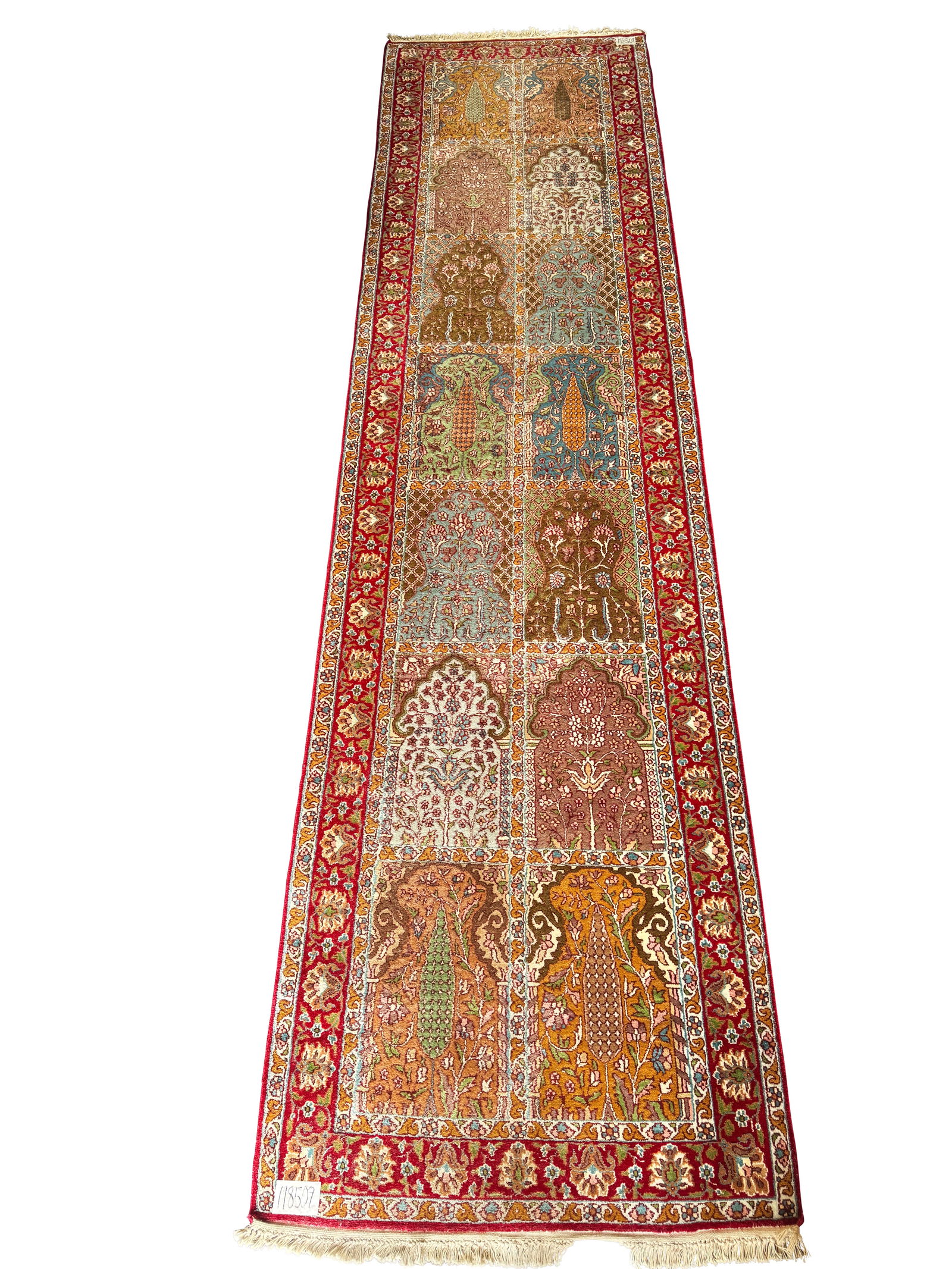 Kashmir 'Garden of Persia' Hall Runner,: of long rectangular form, set with a series of ogee arches to the central panel displaying flowering trees and foliage, framed by multiple borders, in rich tones of red, blue, orange, green, brown and