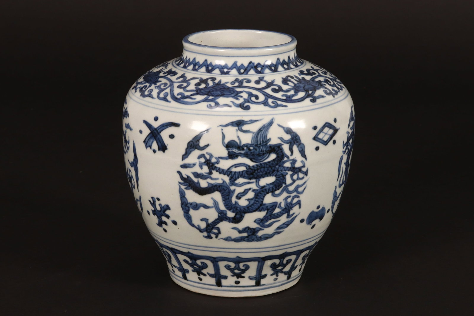 Chinese Blue and White Porcelain Jar,: of baluster form, decorated with roundels containing a dragon amongst stylised clouds and precious objects, below a border of flowers and scrolling foliage, height 19cm