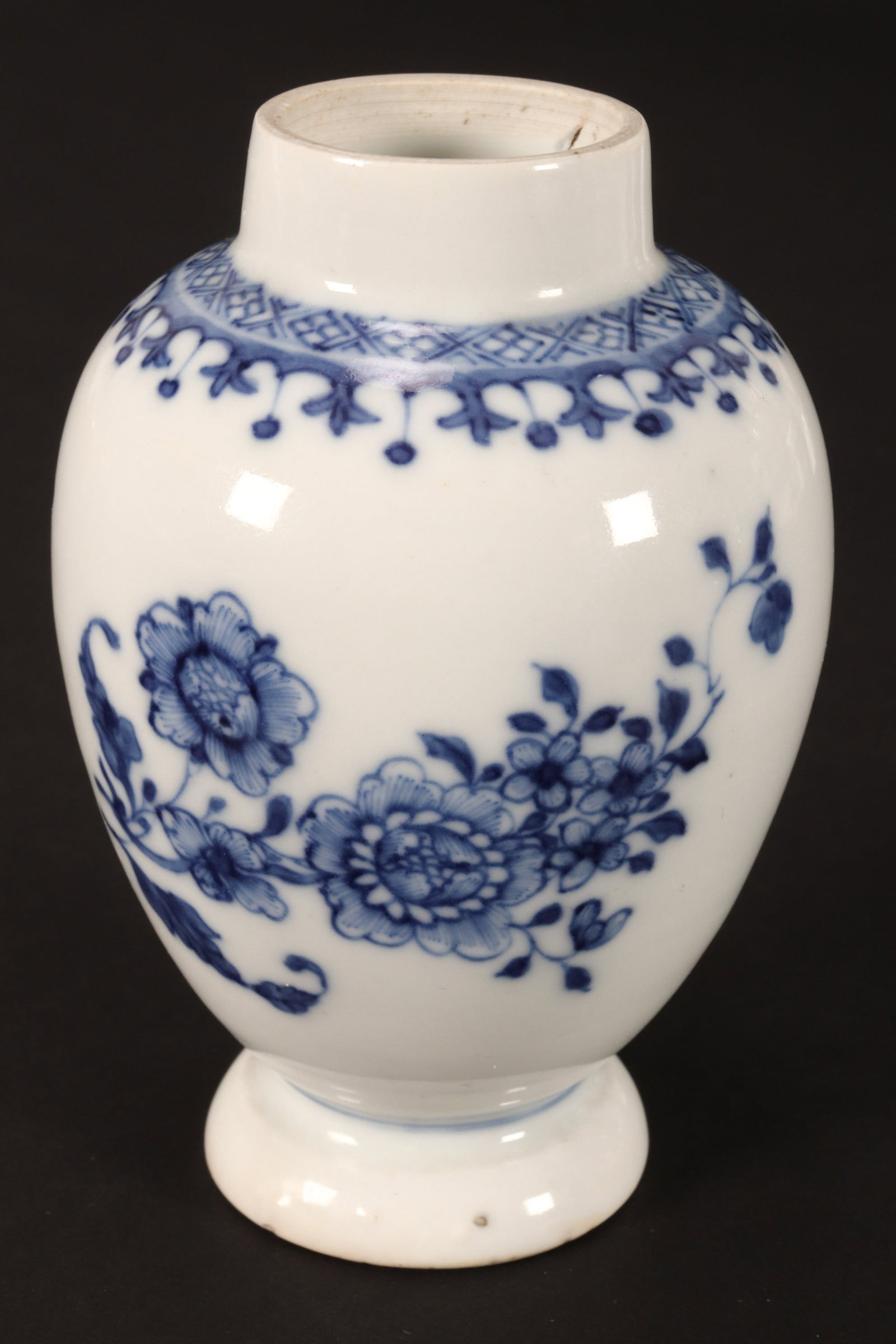Chinese Kangxi Period Blue and White Porcelain Vase,: of baluster form with a short rim, decorated with sprays of flowers and fine borders, raised on a domed foot, height 10.5cm